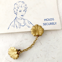Load image into Gallery viewer, sweater clip with lily pad shaped leaves and vintage image of 1950s woman wearing a sweater clip