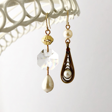 Load image into Gallery viewer, asymmetric earrings in gold and pearl tones with chandelier crystal hanging in front of a white background