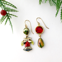 Load image into Gallery viewer, Pair of festive earrings with red and green accents on a white background with Christmas tree branches.