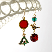 Load image into Gallery viewer, Asymmetric Christmas themed earrings hanging against a white background
