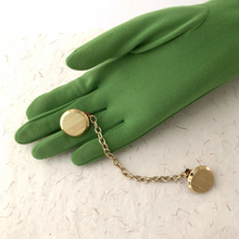 Load image into Gallery viewer, gold-tone sweater clip displayed on a gloved hand