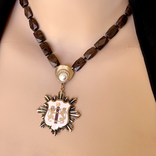 Load image into Gallery viewer, Necklace with an enamelled heraldic pendant displayed on a mannequin