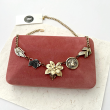 Load image into Gallery viewer, Necklace made with vintage metal leaves and a squirrel charm on a vintage pink velvet jewellery box