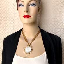Load image into Gallery viewer, mannequin wearing a front opening necklace with replica American silver dollar in vintage brooch setting with vintage brick chain