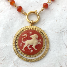 Load image into Gallery viewer, close-up of vintage zodiac resin cameo in vintage pendant setting with carnelian beads