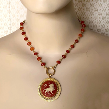 Load image into Gallery viewer, mannequin wearing vintage zodiac resin cameo in vintage pendant setting with hand-wired carnelian beads