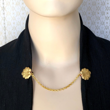 Load image into Gallery viewer, sweater clip with brass lily-pad leaves clipped to black jacket