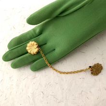 Load image into Gallery viewer, sweater clip with brass lily-pad leaves displayed on a gloved hand
