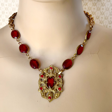 Load image into Gallery viewer, Medieval styled necklace with red gemstones and gold chain on a mannequin