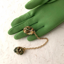 Load image into Gallery viewer, sweater-guard or sweater clip set with chips of Ocean Jasper displayed on a gloved hand