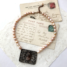 Load image into Gallery viewer, Freshwater pearl necklace with metal filigree cameo focal on vintage postcards