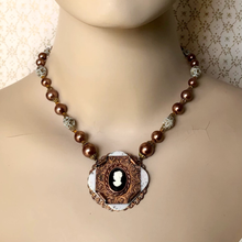 Load image into Gallery viewer, Necklace with a vintage cameo pendant and vintage beads on a mannequin