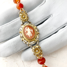 Load image into Gallery viewer, close-up of bracelet with vintage cameo and Carnelian beads displayed on a gloved hand