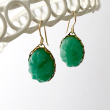 Load image into Gallery viewer, Vintage Peking glass oval stones in brass plated steel settings displayed against a white background