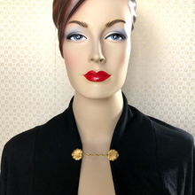 Load image into Gallery viewer, mannequin wearing a black jacket held together with a golden lily pad sweater clip