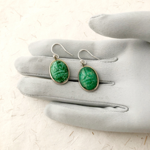 Load image into Gallery viewer, upcycled vintage Peking glass scarab earrings on a grey gloved hand
