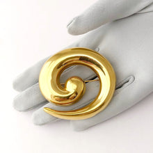 Load image into Gallery viewer, bold golden swirl brooch displayed on a gloved hand
