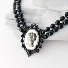 Load image into Gallery viewer, reimagined vintage victorian gothic cameo necklace with vintage Czech glass beads displayed on a gloved hand