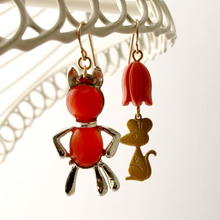 Load image into Gallery viewer, cat and mouse earrings hanging from a white frame
