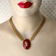 Load image into Gallery viewer, Mannequin with red lips wearing a gold chain necklace with a red cameo focal
