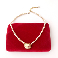 Load image into Gallery viewer, pearl and cameo necklace displayed on a vintage red velvet jewellery box
