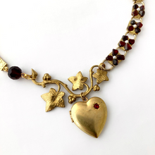 Load image into Gallery viewer, close up of asymmetric necklace in red and gold with heart shaped locket
