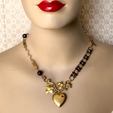 Load image into Gallery viewer, asymmetric necklace in red and gold on a mannequin
