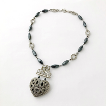 Load image into Gallery viewer, statement necklace in hematite and silver tones with large heart focal displayed on a white background
