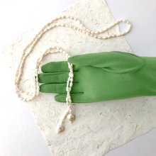 Load image into Gallery viewer, freshwater pearl wrap necklace displayed with a green gloved hand
