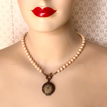 Load image into Gallery viewer, mannequin wearing necklace featuring a vintage perfume locket and mid-century pearl beads 
