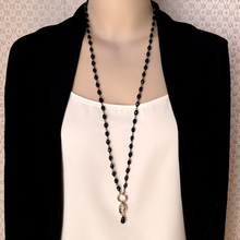 Load image into Gallery viewer, A long reimagined vintage necklace with black beads and cameo set focal pendant displayed on a mannequin

