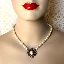Load image into Gallery viewer, Pearl necklace with cameo focal  on a mannequin
