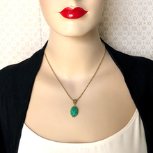 Load image into Gallery viewer, Mannequin with red lips wearing a Peking glass pendant 
