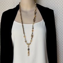 Load image into Gallery viewer, long bead and chain necklace in caramel colours with mother-of-pearl pendant displayed on a mannequin
